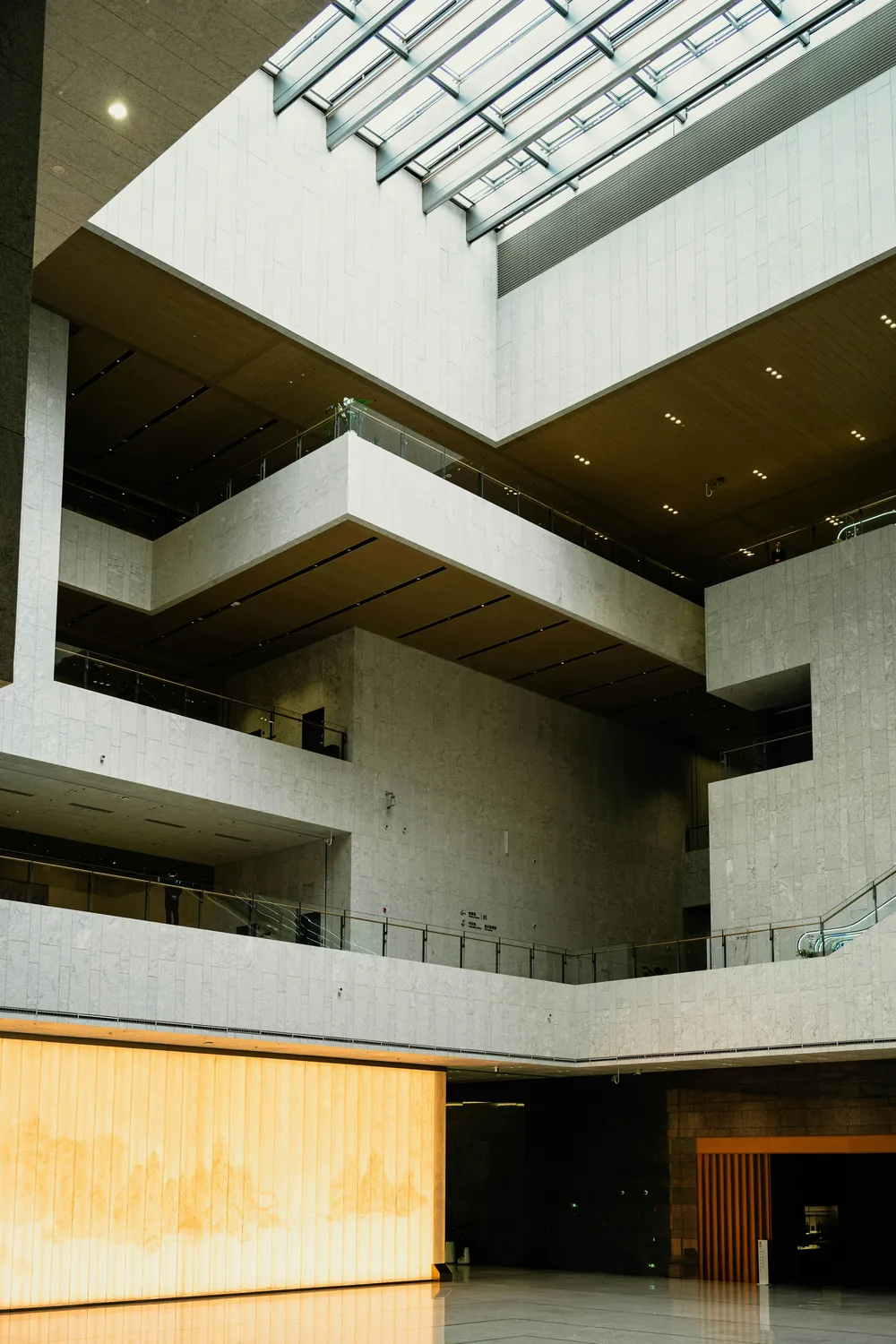 Contemporary architectural interior with skylight and layered balconies